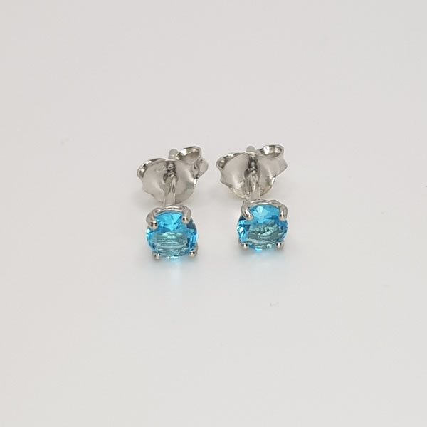 Let this sparkling 4mm blue topaz stud earrings release your tension. This gemstone is known as the stone of love, affection and good fortune. 