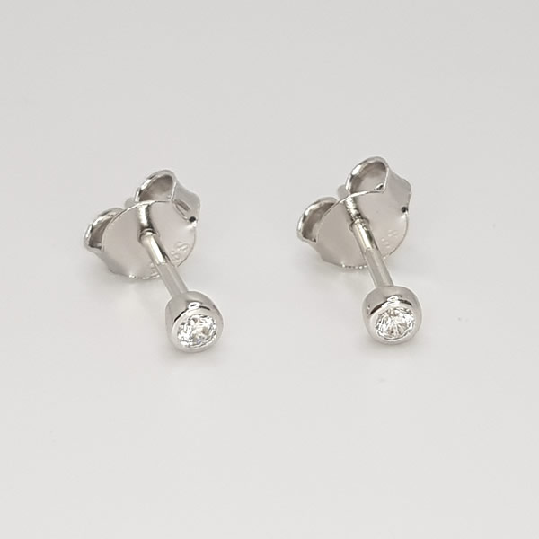 Gorgeous and cute tiny white stud earrings making special piercings a pleasure.